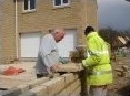 Adding the coping stones to the boundary wall