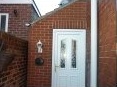 Lean-to porch to the side of a property