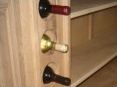 Sections in bar construction "Routed Out" in order to house wine bottles