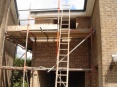 Two storey side extension with garage showing added fascia and soffit boards