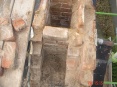 Stripped down chimney stack revealing a blocked chimney used as a bird nest
