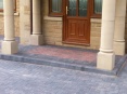 Feature matwell formed in brindle paving to form entrance as a contrast