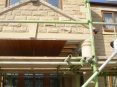 Golden oak cladding used to underside of portico in order to disguise underside of trusses