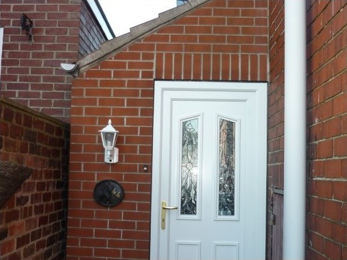 Lean-to porch to the side of a property