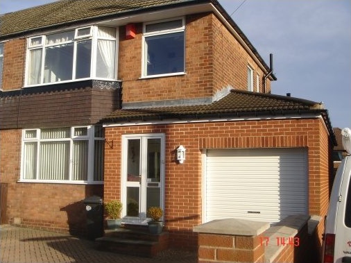 Single storey garage extension with rear utility room