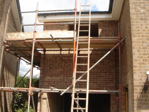 Two storey side extension with garage showing added fascia and soffit boards