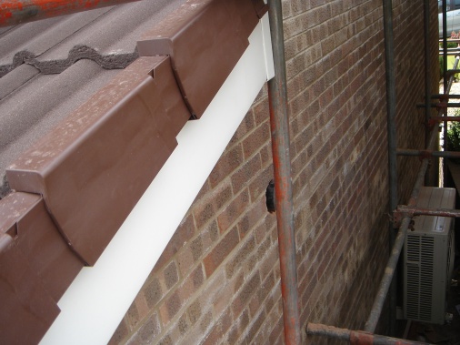 Dry ridge pack added to tile ends on roof of kitchen extension