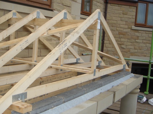 Roof trusses spaced out at 350mm centres and braces for stability