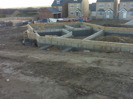 Foundation of a squint block formed in 7newton trench blocks, incorporating a splash course up to dpc of stone.squint bay and internal Walls constructed to site drawings
